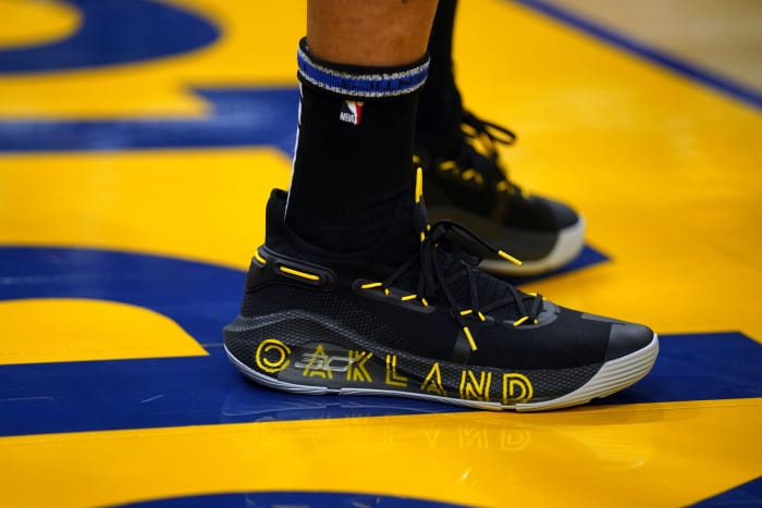 Golden State Warriors point guard Stephen Curry wearing the Under Armour Curry 6 'Thank You'.